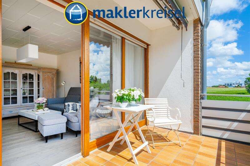 Nordseeheilbad Carolinensiel: schicke Eigentumswohnung mit Balkon und Garage in zentraler Lage